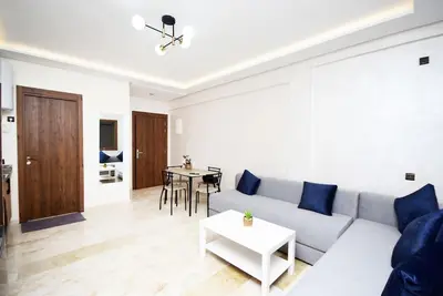 a living room with a couch and a table at Appartement Marrakech Hivernage. in Marrakech