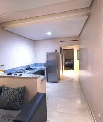 a kitchen with a sink and a refrigerator at Gueliz budget Stay in Marrakech