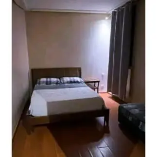 a bedroom with a bed and a couch in it at Gueliz budget Stay in Marrakech