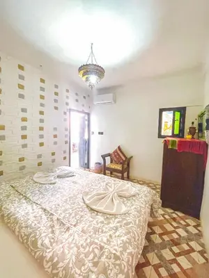 a bedroom with a bed with two plates on it at Sun Hostel in Marrakech