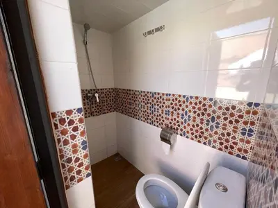 a bathroom with a toilet and a sink at Sun Hostel in Marrakech