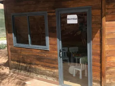 a door to a house with a sign on it at OASIS PALM MARRAKECH APARTMENT- 5 Piscines in Marrakech