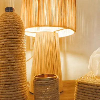 a lamp sitting on a table next to a vase at Riad Belikoss Pool & SPA in Marrakech