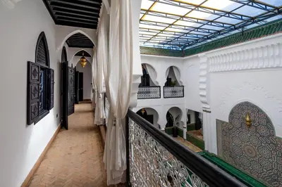 a corridor in a building with a glass ceiling at The Grand Riad and Spa in Marrakech