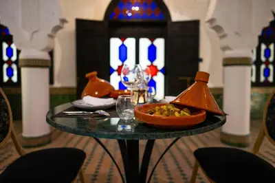 a table with a bowl of food on top of it at The Grand Riad and Spa in Marrakech