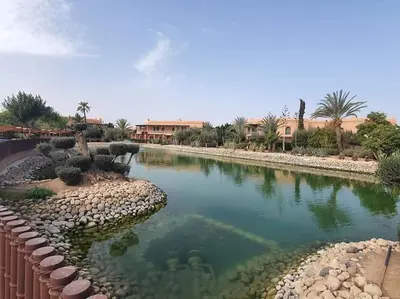 a river in the middle of a resort at NEW appartement in palmeraie in Marrakech