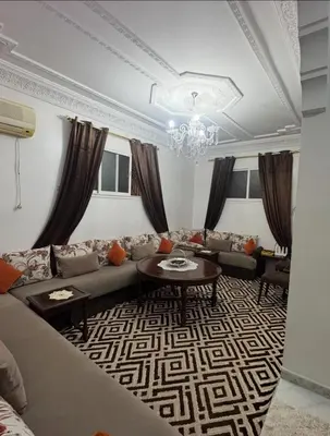 a living room with a couch and a table at Marrakech in Marrakech