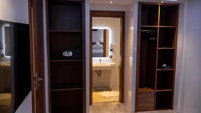 a room with a bathroom with a sink and a mirror at Villa HAW Marrakech in Marrakech
