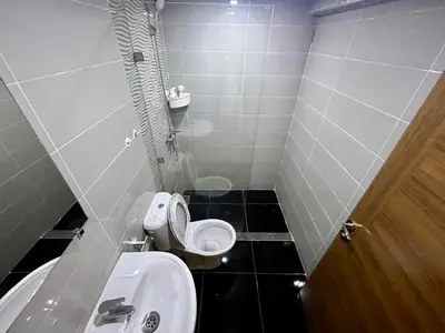 a small bathroom with a toilet and a sink at Al Badiya Marrakech in Marrakech