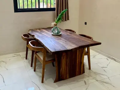 a wooden table with a plant on top of it at Al Badiya Marrakech in Marrakech
