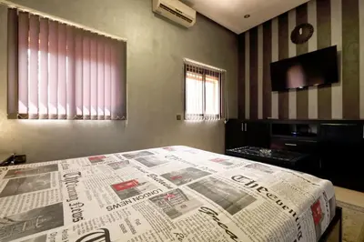 a bedroom with a news paper on a bed at Appartement centre de Marrakech in Marrakech