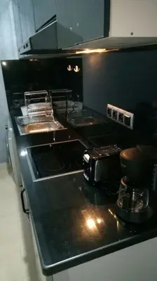 a kitchen with a stove and a counter top at Appartement centre de Marrakech in Marrakech
