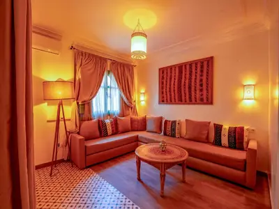 a living room with a couch and a table at Riad Dar Sido in Marrakech