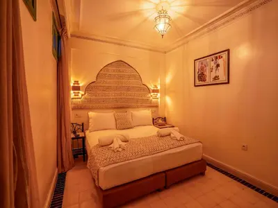 a bedroom with a bed in a room at Riad Dar Sido in Marrakech