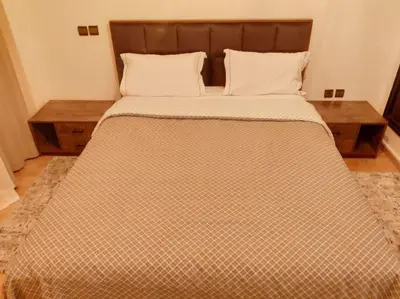 a large bed with two pillows on top of it at Appartement gueliz in Marrakech