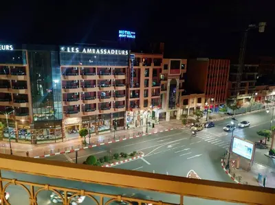 a view of a city street at night at Appartement gueliz in Marrakech