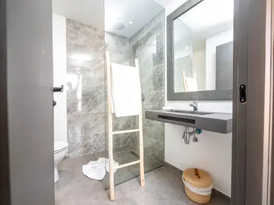 a bathroom with a sink and a mirror and a toilet at Fashion Boutique Hotel in Marrakech