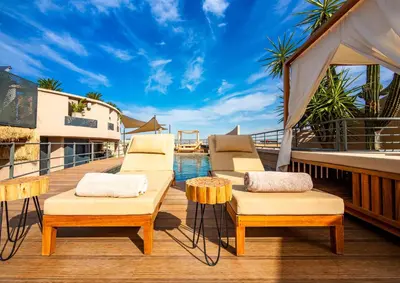 a deck with two chairs and a gazebo at Fashion Boutique Hotel in Marrakech