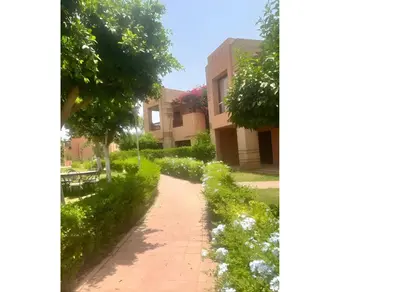 a walkway in front of a building at Bright condo w/ pool in Marrakech