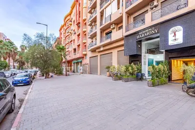 an empty street in front of a building at Duplex Centre-ville Guéliz in Marrakech