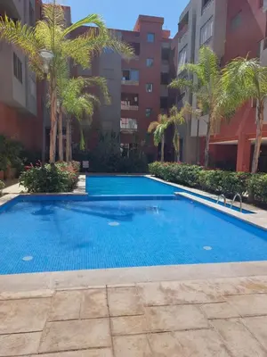 a swimming pool in the middle of a building at Centre Marrakech, Chic et Calme in Marrakech