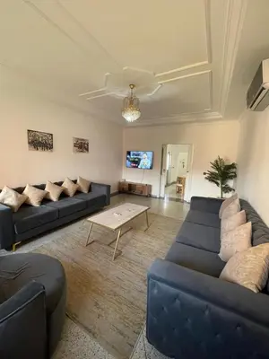a living room with two couches and a table at Luxury Apartment in Marrakesh in Marrakech