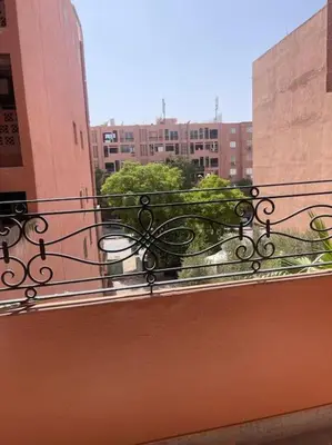 an iron railing on a balcony in a city at Luxury Apartment in Marrakesh in Marrakech