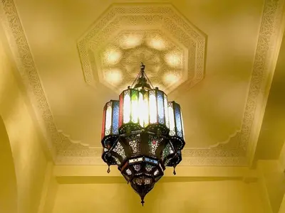 a chandelier hanging from a ceiling in a room at Riad Signature in Marrakech
