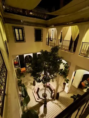 an overhead view of a room with a table and trees at Riad Signature in Marrakech
