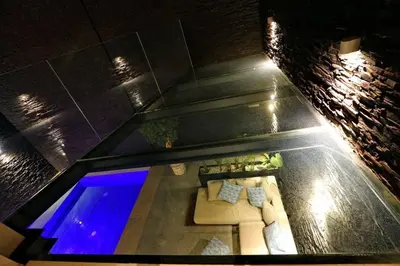an overhead view of a swimming pool at night at Duplex de luxe, piscine sauna in Marrakech