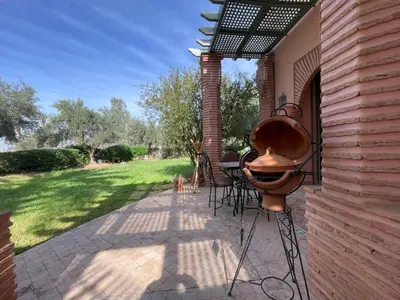 a grill on the side of a house at Au Riad de la Palmeraie - Marrakech in Marrakech