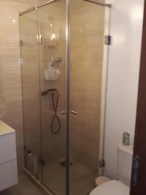 a shower with a glass door in a bathroom at Prestigia Agate golf Piscine Marrakech in Marrakech