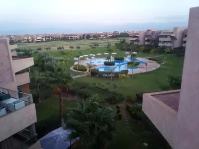 an aerial view of a resort with a swimming pool at Prestigia Agate golf Piscine Marrakech in Marrakech