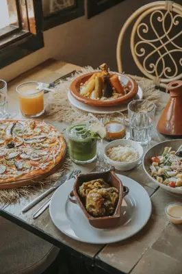 a table with many plates of food on it at Riad Casa Kasbah in Marrakech