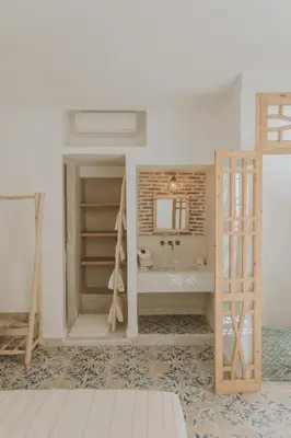 a bathroom with a tub and a sink in a room at Riad Casa Kasbah in Marrakech