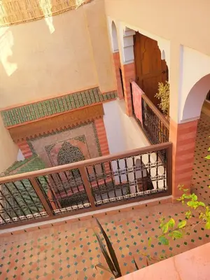 a stairway with a tile floor and a door at Riad Rayan in Marrakech