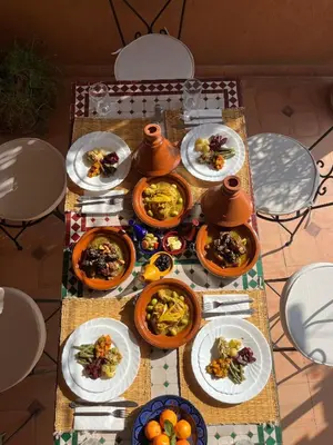 a table full of plates of food on a table at Riad Rayan in Marrakech