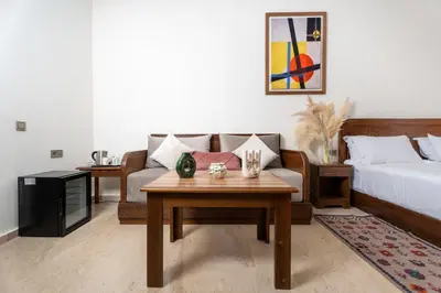 a living room with a bed and a coffee table at Dar Nourdha in Marrakech