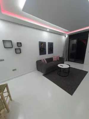 a living room with a couch and a table at Kech vacations Friendly 2 Bedroom Luxury apartment in Marrakech