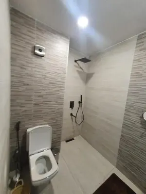 a bathroom with a toilet and a shower at Kech vacations Friendly 2 Bedroom Luxury apartment in Marrakech