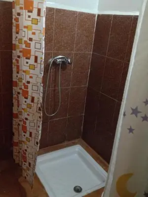 a bathroom with a shower with a tub at Riad Espagne in Marrakech