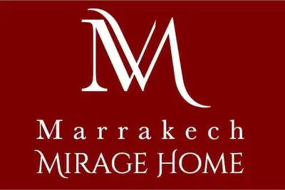 a sign for a marriott mage home with the letter m at Appartamento nel quartiere Gueliz , Marrakech in Marrakech