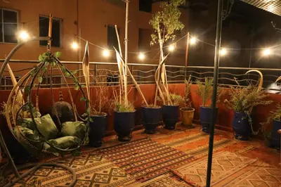 a row of potted plants on a table with lights at Appartamento nel quartiere Gueliz , Marrakech in Marrakech