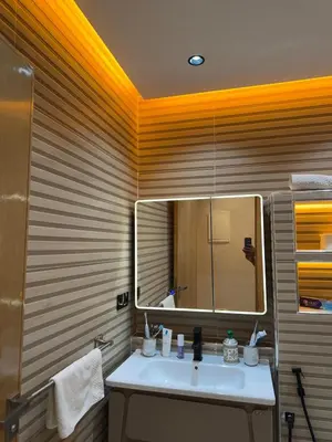 a bathroom with a sink and a mirror at Bel appartement à louer à Marrakech targa in Marrakech