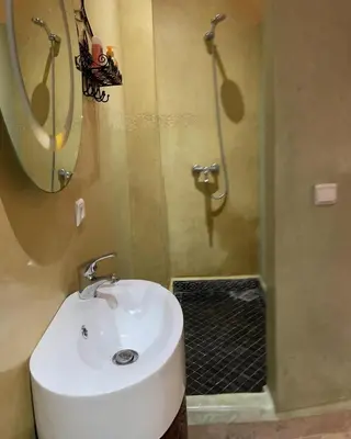 a bathroom with a sink and a shower at RIAD LAICHI in Marrakech