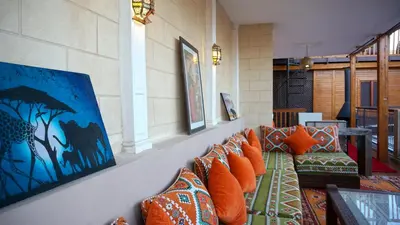 a room with a bunch of pillows on a wall at RIAD KALE POLIS in Marrakech