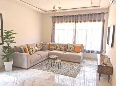 a living room with a couch and a table at Perfect home in Marrakech in Marrakech