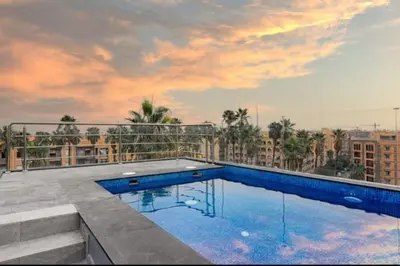 a swimming pool on the roof of a building at Perfect home in Marrakech in Marrakech