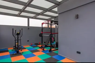 a room with a gym with a treadmill and weights at Perfect home in Marrakech in Marrakech