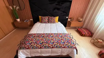 a bedroom with a large bed in a room at LA FINCA DE MARRAKECH in Marrakech